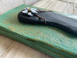 Stone Flip Flop on Salvage Wood